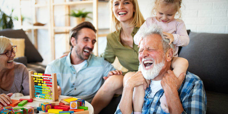 Super Visa Sponsorship Canada Services- grandparents smiling with their grandchildren